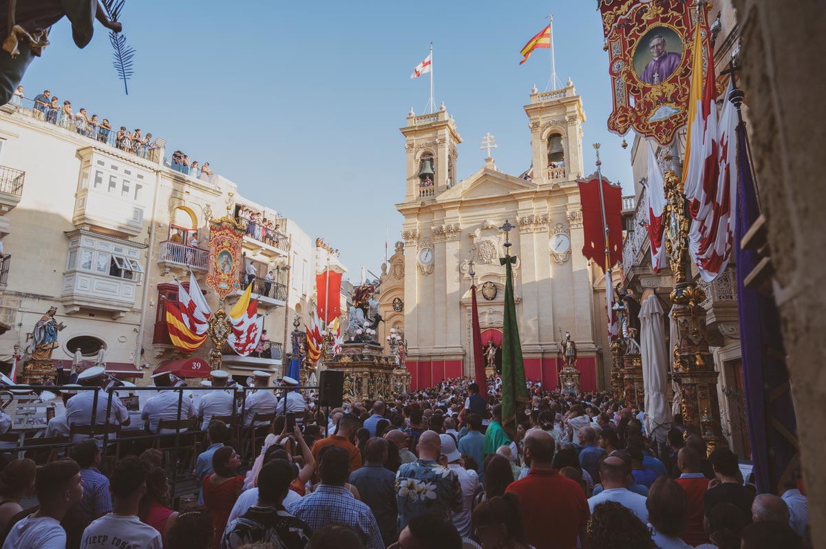 The statue of St. George emerging from St. George’s Basilica during the annual festa in Victoria, Gozo, celebrated every third Sunday of July.